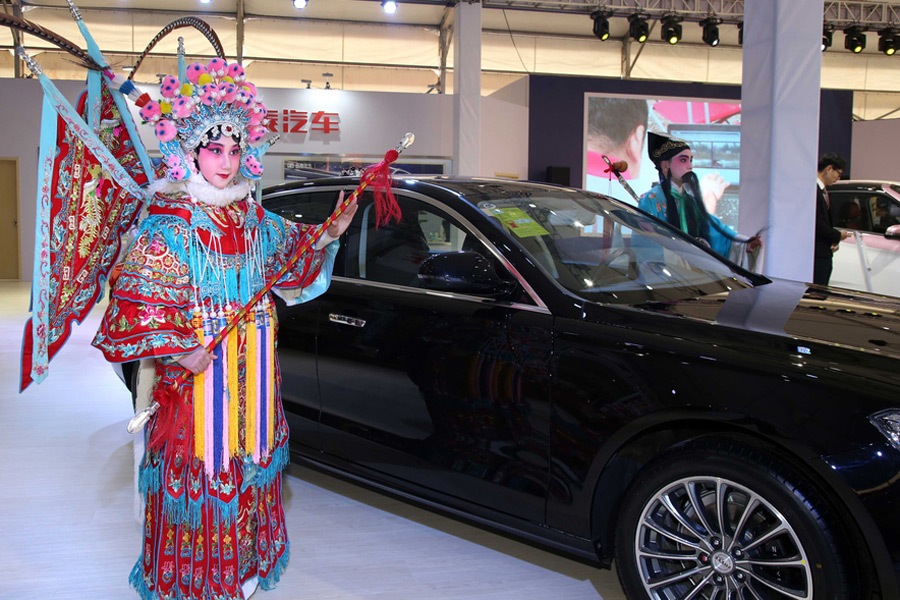 Tradition meets technology: Wu Opera performers take over car show