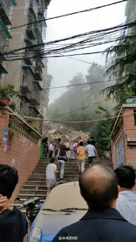 Nine-story building collapses after landslide, 16 missing