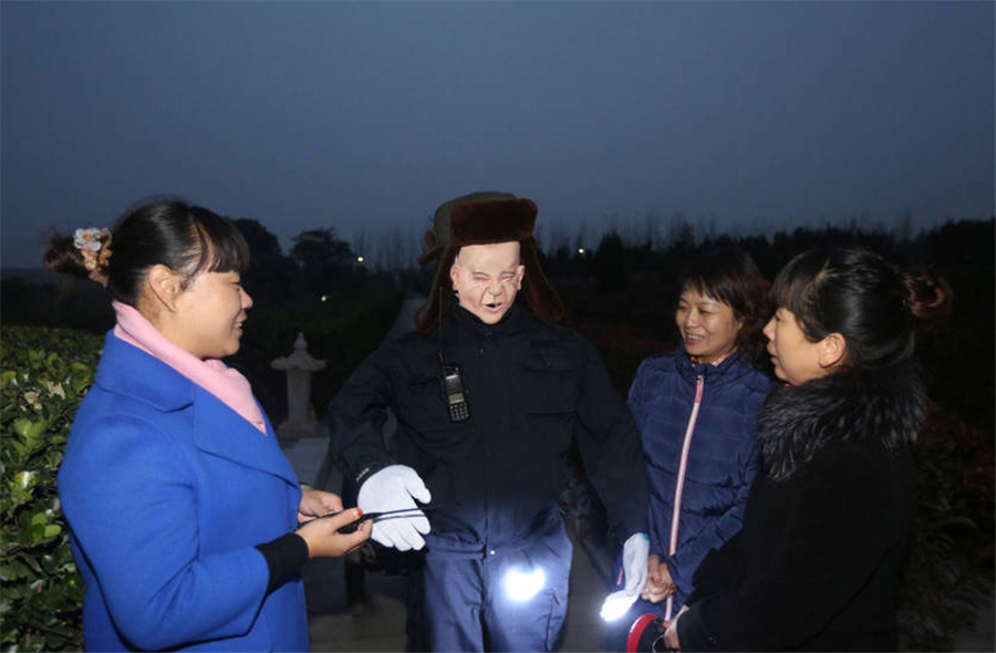 Cemetery in central China deploys creepy robot guard to escort female patrol guards at night