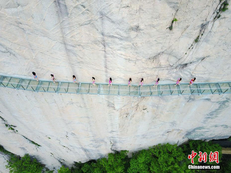 Models catwalk in bikini on 1,000-meter-high mountainside