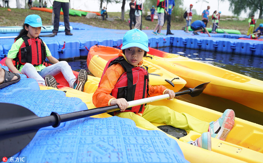 Children test survival skills in woods and on water