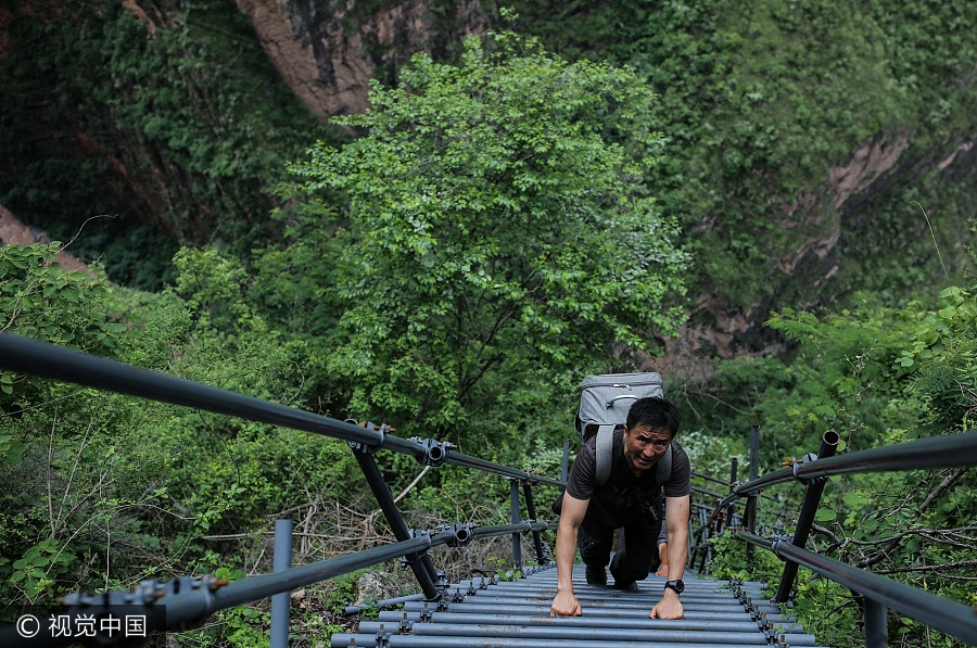 Photographer's work changes life of 'cliff village'