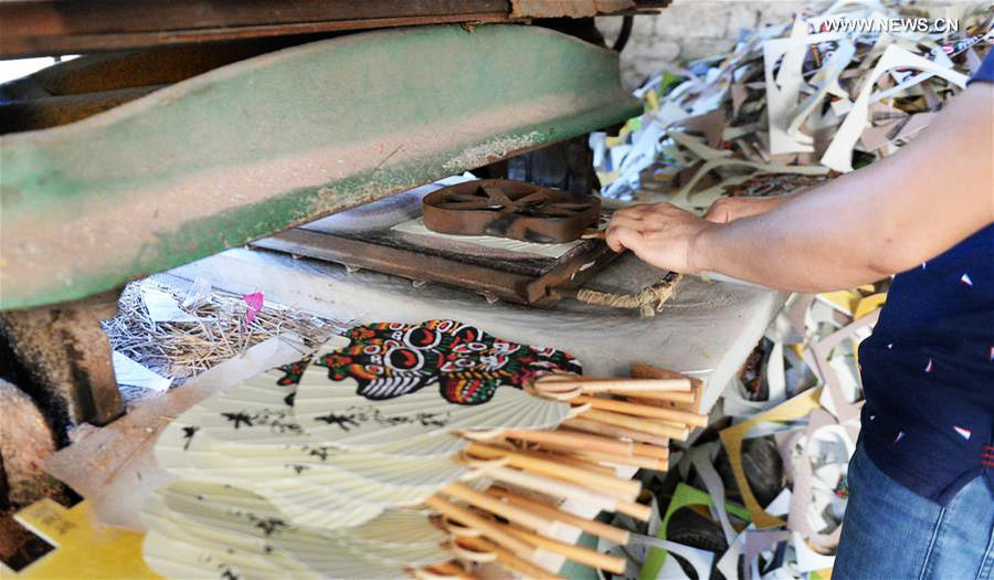 Traditional moon-shaped fan made in Guangxi