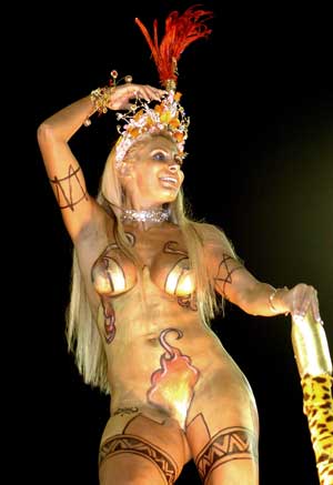 A reveler from the Imperador do Ipiranga samba school rides atop a float on the first night of the Carnival parades in Sao Paulo, late February 4, 2005. Brazilians of all walks of life sang and danced during the annual Carnival festivities. 