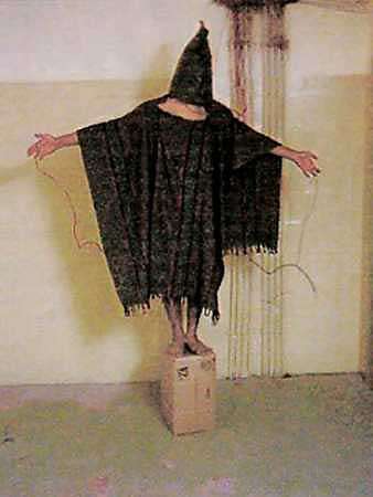 A hooded and wired Iraqi prisoner at Iraq's Abu Ghraib prison is seen in this undated photo. [Reuters/file] 