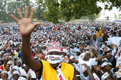 Zimbabwean Movement for Democratic Change (MDC) supporters give the party's open hand salute during an election rally in Harare, Zimbabwe, Sunday, March 27, 2005. Morgan Tsvangirai, leader of the MDC, held the rally ahead of parliamentary elections set for March 31. Zimbabwe's ruling party is confident it will win a two-thirds majority in this week's parliamentary elections, an official said, while the opposition countered that worsening poverty would drive people to the polls to protest President Robert Mugabe's policies. [AP]