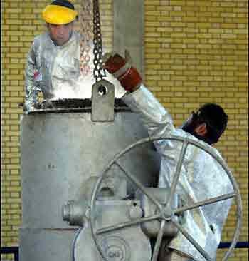 Two Iranians work at the zirconium production plant, part of the nuclear facilities in Isfahan, in March 2005. Europe must heed an Iranian proposal on uranium enrichment or risk a collapse of talks about Iran's nuclear programme, the country's top nuclear official said in an interview.(AFP/File