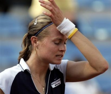 Russia's Elena Bovina reacts after losing a point to fellow Russian Maria Sharapova during their quarter final match of the women's Italian Open tennis tournament at Rome's Foro Italico, Friday, May 13, 2005. Sharapova beat Bovina 6-2, 6-2. (AP