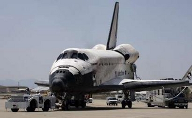 The Space Shuttle Discovery is towed off the runway in Edwards Air Force Base in California August 9, 2005. 