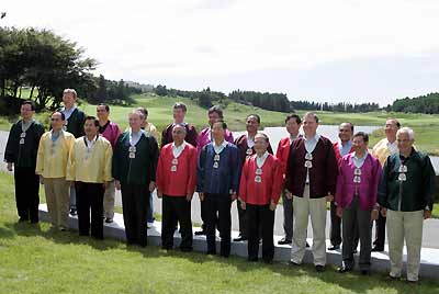 APEC finance ministers and deputies pose at the 12th APEC Finance Ministers Meeting in Sogwipo on Cheju island, south of Seoul, September 9, 2005. (front row L-R) Singapore's second minister for finance Raymond Lim Siang Keat, Taiwan's finance minister Lin Chuan, Thai Finance Minister Thanong Bidaya, U.S. Treasury Deputy Secretary Robert Kimmitt, Chile's deputy finance minister Saez Raul, South Korea's finance minister Han Duck-soo, Vietnam's minister of finance Nguyen Sinh Hung, Australia's Treasurer Peter Costello, Brunei's Minister of Finance II Pehin Dato Haji Abd. Rahman bin Haji Ibrahim and Canada's Minister of National Revenue John McCallum. (back row L-R) Russia's finance minister Alexei Leonidovich Kudrin, the Philippines' undersecretary of international finance group Roberto Tan, Peru's deputy finance minister Waldo Mendoza Bellido, New Zealand's finance minister John Whitehead, an unidentified finance official from Mexico, Malaysian Deputy Minister of Finance II Tengku Putera bin Tengku Awang, Japan's parliamentary vice minister of finance Yukio Danmoto, Indonesia's finance minister Jusuf Anwar and China's finance minister Jin Renqing.