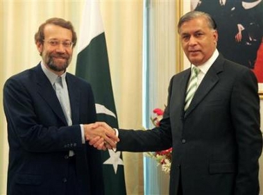 Pakistan Prime Minister Shaukat Aziz (R) greets Iran's top nuclear negotiator Ali Larijani in Islamabad September 7, 2005.