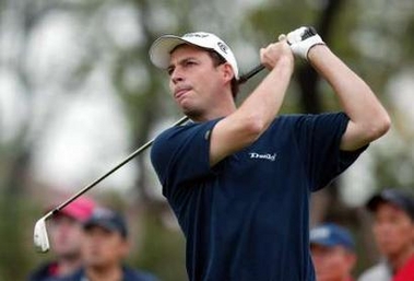 British Golfer David Howell takes a shot during the second day for the Champions golf tournament in Shanghai, China November 11, 2005.