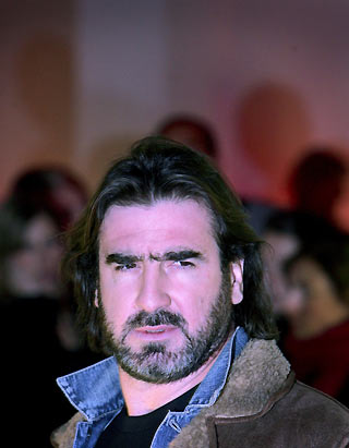 France's Eric Cantona arrives for the launch of the "Joga Bonito" (Play Beautiful) soccer movement at the Truman Brewery in east London, February 7, 2006. The launch was to support French and former Manchester United footballer Eric Cantona's vision to reduce the pervading negative tactics, play acting and a lack of passion in the modern professional game. [Reuters]