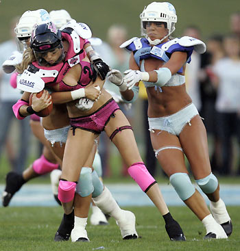 Los Angeles Temptation(blue) play against New York Euphoria during the third annual Lingerie Bowl football game in Los Angeles February 5, 2006. The 30-minute game features models playing full-contact football in lingerie and airs locally on pay-per-view during half time of the NFL's Super Bowl XL football game. [Reuters]