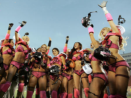 Los Angeles Temptation(blue) play against New York Euphoria during the third annual Lingerie Bowl football game in Los Angeles February 5, 2006. The 30-minute game features models playing full-contact football in lingerie and airs locally on pay-per-view during half time of the NFL's Super Bowl XL football game. [Reuters]