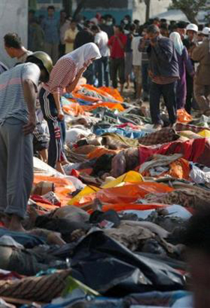 Bodies piled on coasts as tsunami kills 24,000