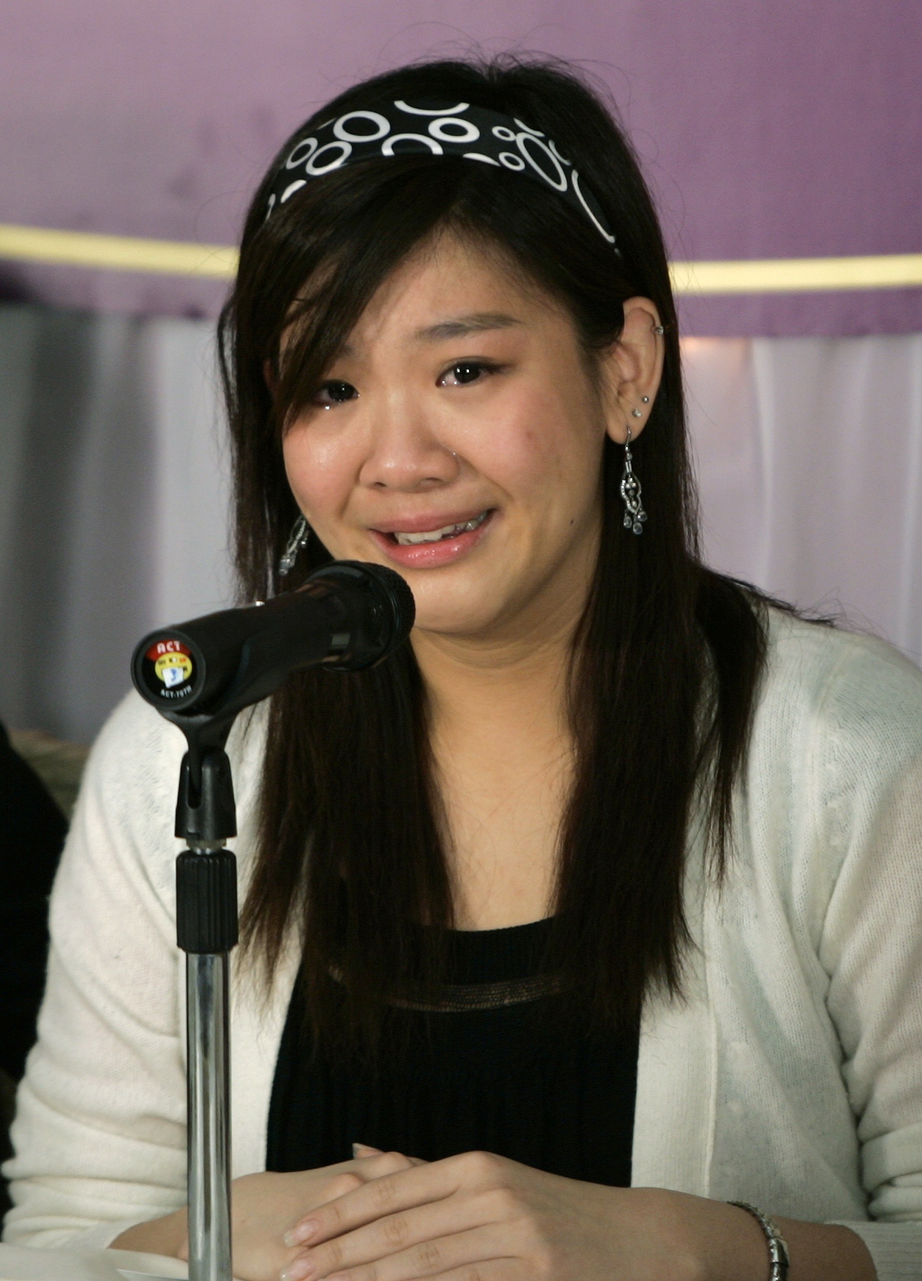 Lydia Shum's daughter cries during news conference