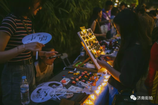 Baihuazhou street bathes in magical night fair