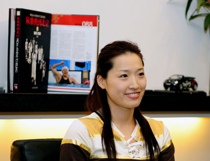 Athens swimming gold medallist Luo Xuejuan, who will be first Chinese Beijing Olympic torchbearer, smiles during an interview in Beijing March 20, 2008. Luo is ready to leave for Olympia, Greece to carry the torch following the first torchbearer Alexandros Nikolaidis when the torch relay starts on March 24, 2008. [Xinhua]