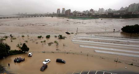 An aerial view shows a flooded area after Typhoon Ewiniar hits Ulsan, about 410 km (256 miles) south of Seoul, July 10, 2006. 