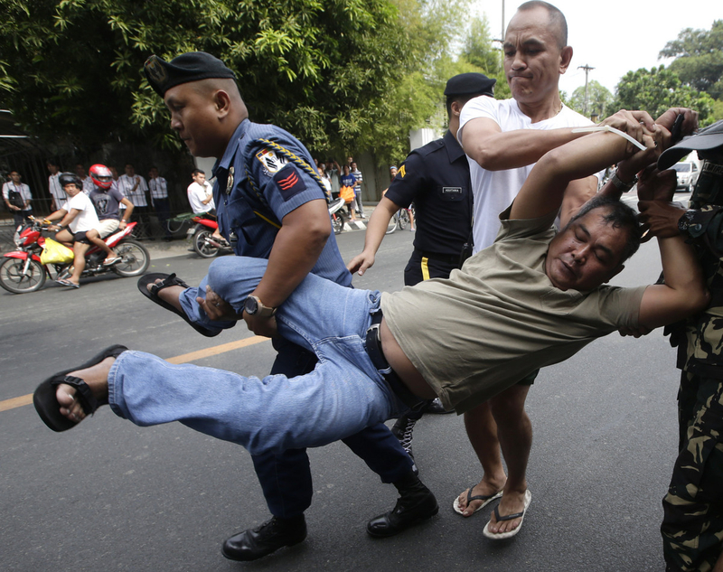 Farmer-protesters sneak into the Malacanang Palace in Manila