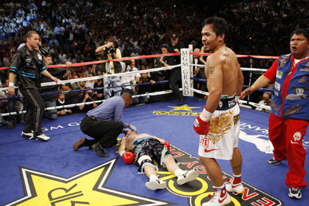 Filipino Pacquiao beats down British boxer