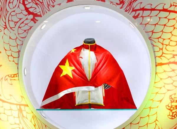 China unveils dragon dress for Olympians