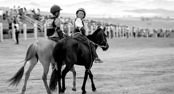 Child jockeys race for money