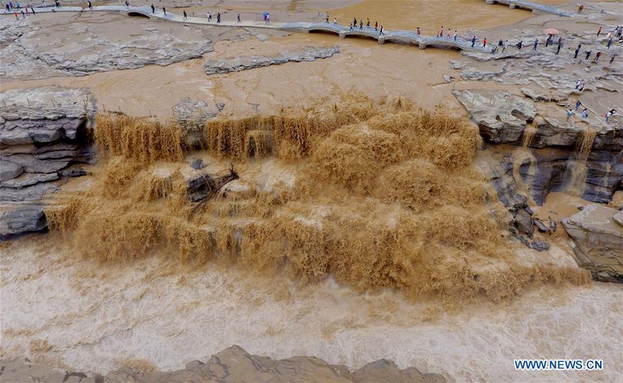 Water volume of Hukou Waterfall surges due to heavy rainfall