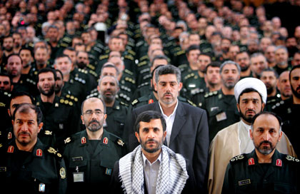 Iranian President Mahmoud Ahmadinejad (front row C) sits with commanders from the Basij Militia in Tehran May 7, 2006. Iran said on Sunday any measures taken against its nuclear programme by the U.N. Security Council would push Tehran towards confrontation with the West rather than cooperation with the U.N. nuclear watchdog. Iran has been referred to the world body after failing to convince the international community that its nuclear power programme is not a smokescreen for building weapons. 