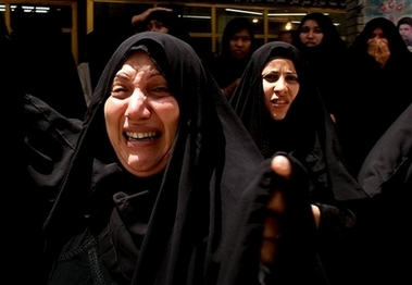 Relatives mourn for Ahmed Ali, 32, who was killed in Friday's bomb attack on the Buratha mosque, one of Baghdad's most important Shiite Mosques, which killed at least 10 people and wounded 20, at his funeral in Najaf, Iraq Saturday, June 17, 2006.[AP] 