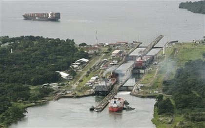 Container ships pass through the Gatun Locks some 80 Kilometers (50 miles) north of Panama City, Panama on Oct. 20, 2006. On Sunday, Oct. 22, 2006, voters were expected to approve the largest modernization project in the 92-year-history of the Panama Canal, expanding the waterway to allow for larger ships while alleviating traffic problems. (AP Photo