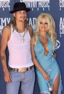 Singer Kid Rock and actress Pamela Anderson arrive at the 37th annual Academy of Country Music Awards in Los Angeles in this May 22, 2002 file photo. Anderson has filed for divorce from Rock after four months of marriage, a pair of celebrity magazines reported on November 27, 2006. 