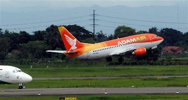 An Adam Air airplane takes off at Sukarno-Hatta international airport in Jakarta, Indonesia, in this May 7, 2004 file photo. An Indonesian passenger plane carrying 102 people disappeared in stormy weather on Monday, Jan. 1, 2007, and rescue teams were sent to search an area where military aviation officials feared the Boeing 737-400 aircraft may have crashed. (AP