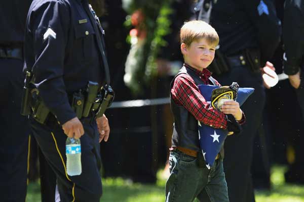 First funerals held for Dallas police slain in racially motivated ambush