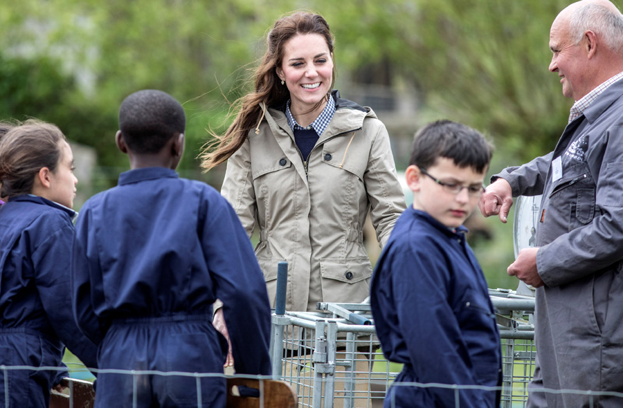 UK's Duchess Catherine joins school children down on the farm