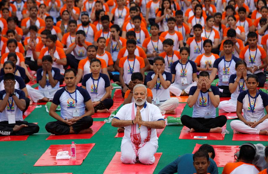 Thousands join India's Modi, hit the mat for International Yoga Day